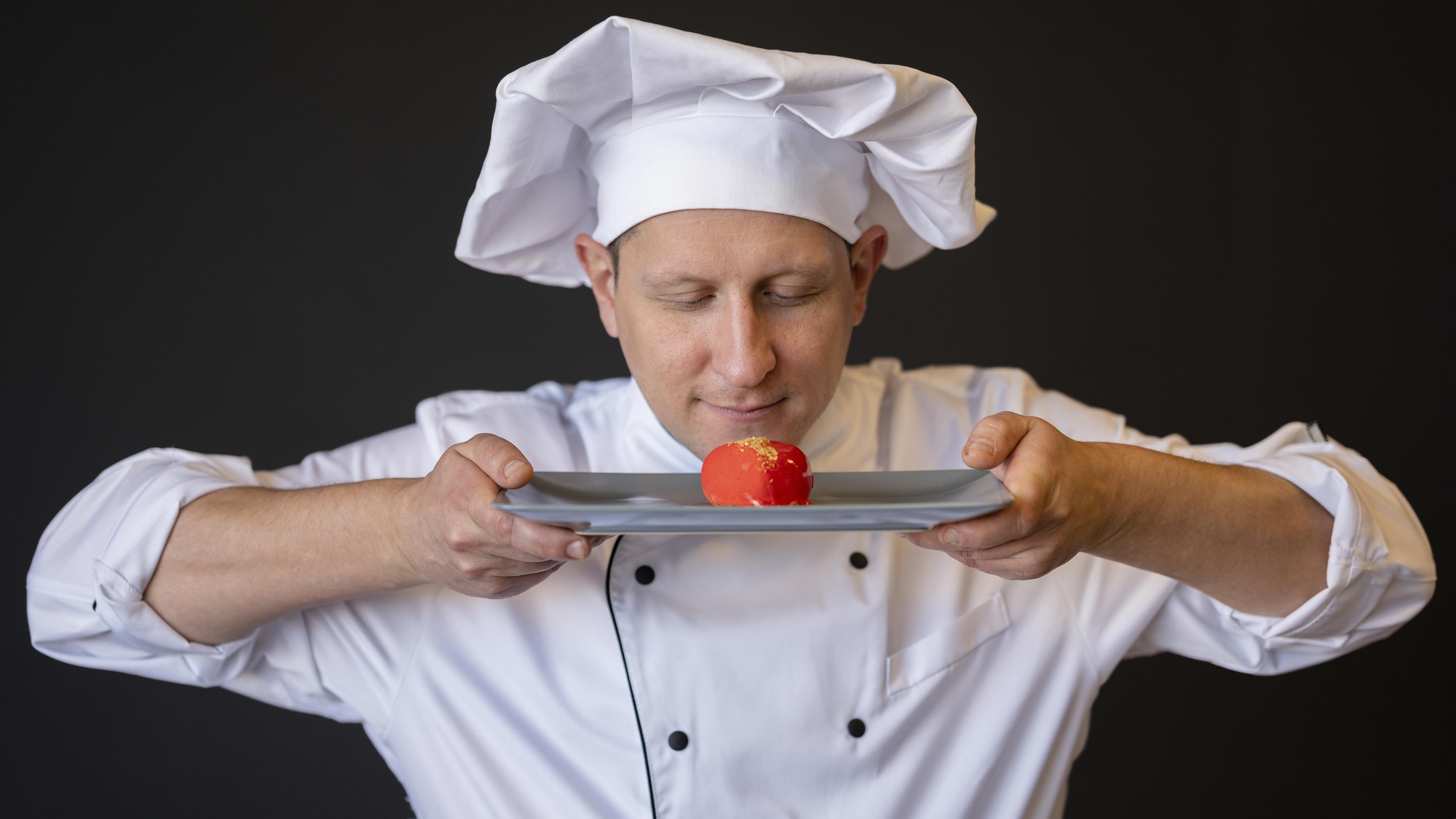 Chef instructor demonstrating plating technique